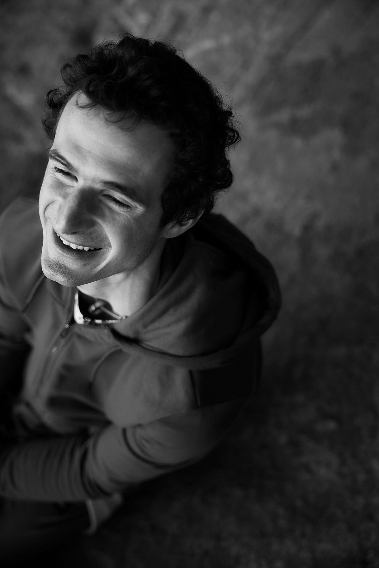 a man smiling with his eyes closed