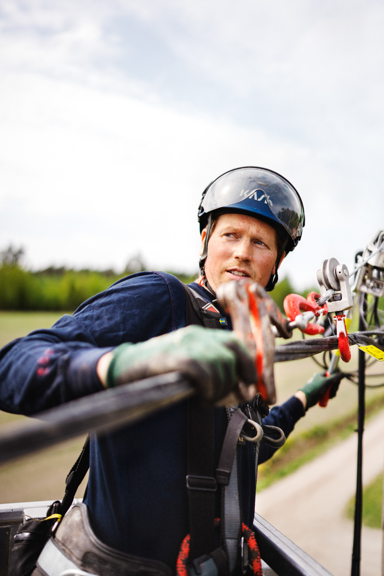 a man wearing a helmet and holding a metal bar