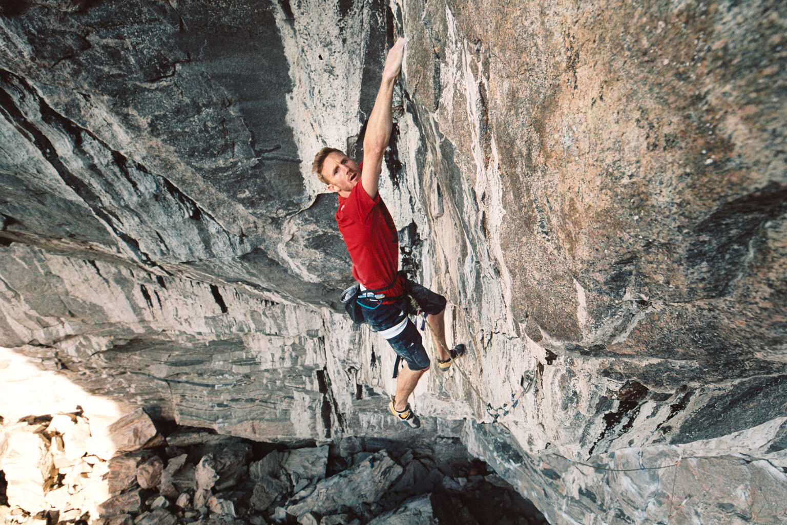 a man climbing a rock wall