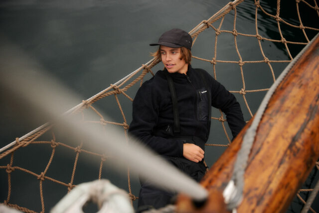 a person sitting on a rope net