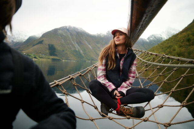 a woman sitting on a hammock