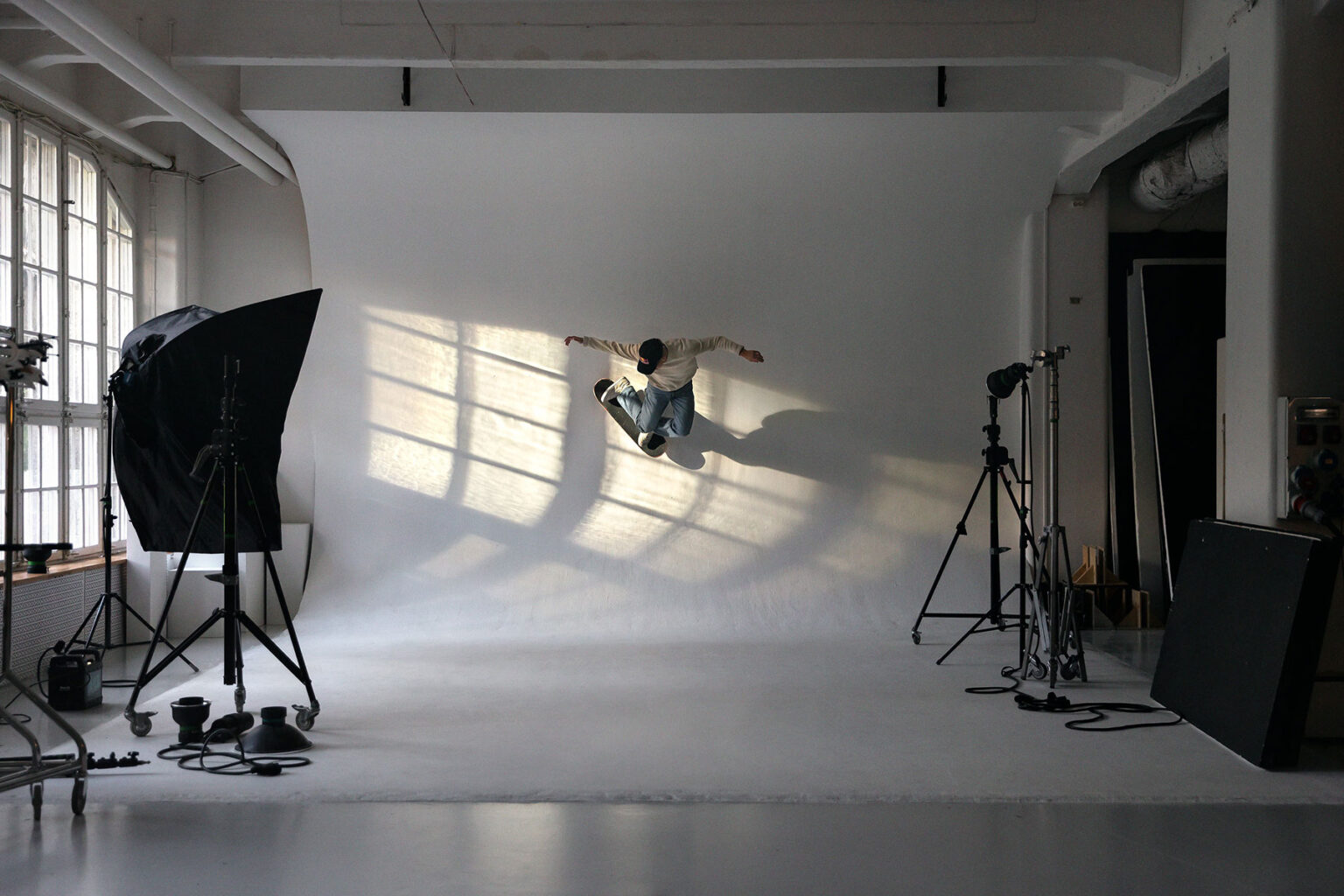 a person jumping in the air in a photo studio
