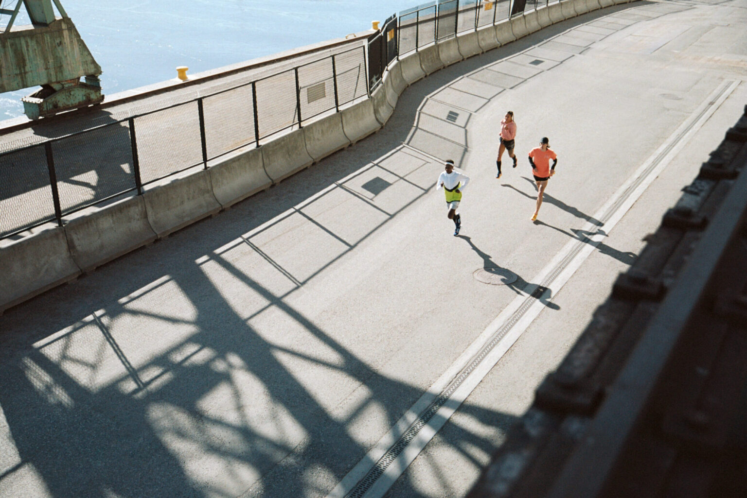 a group of people running on a road
