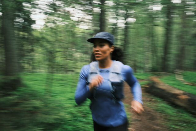 a woman running in the woods