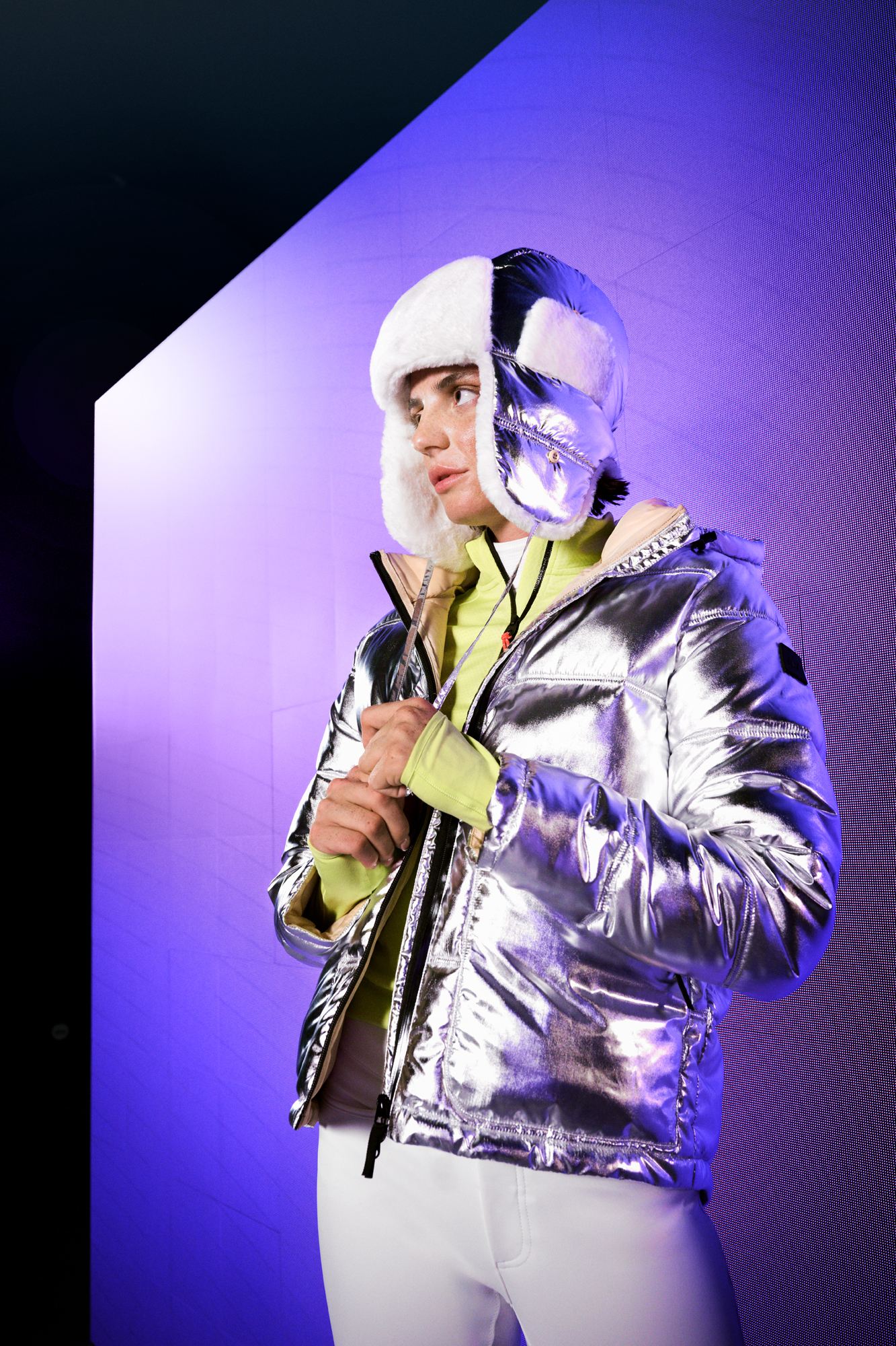 a person in a silver coat