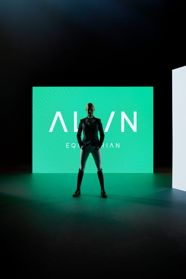 a man standing in front of a green screen
