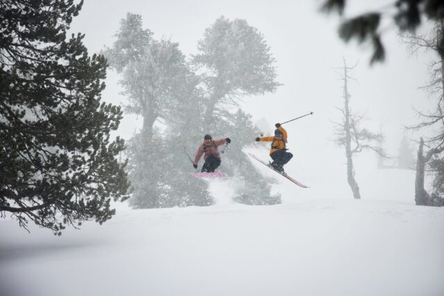 a group of people skiing in the snow