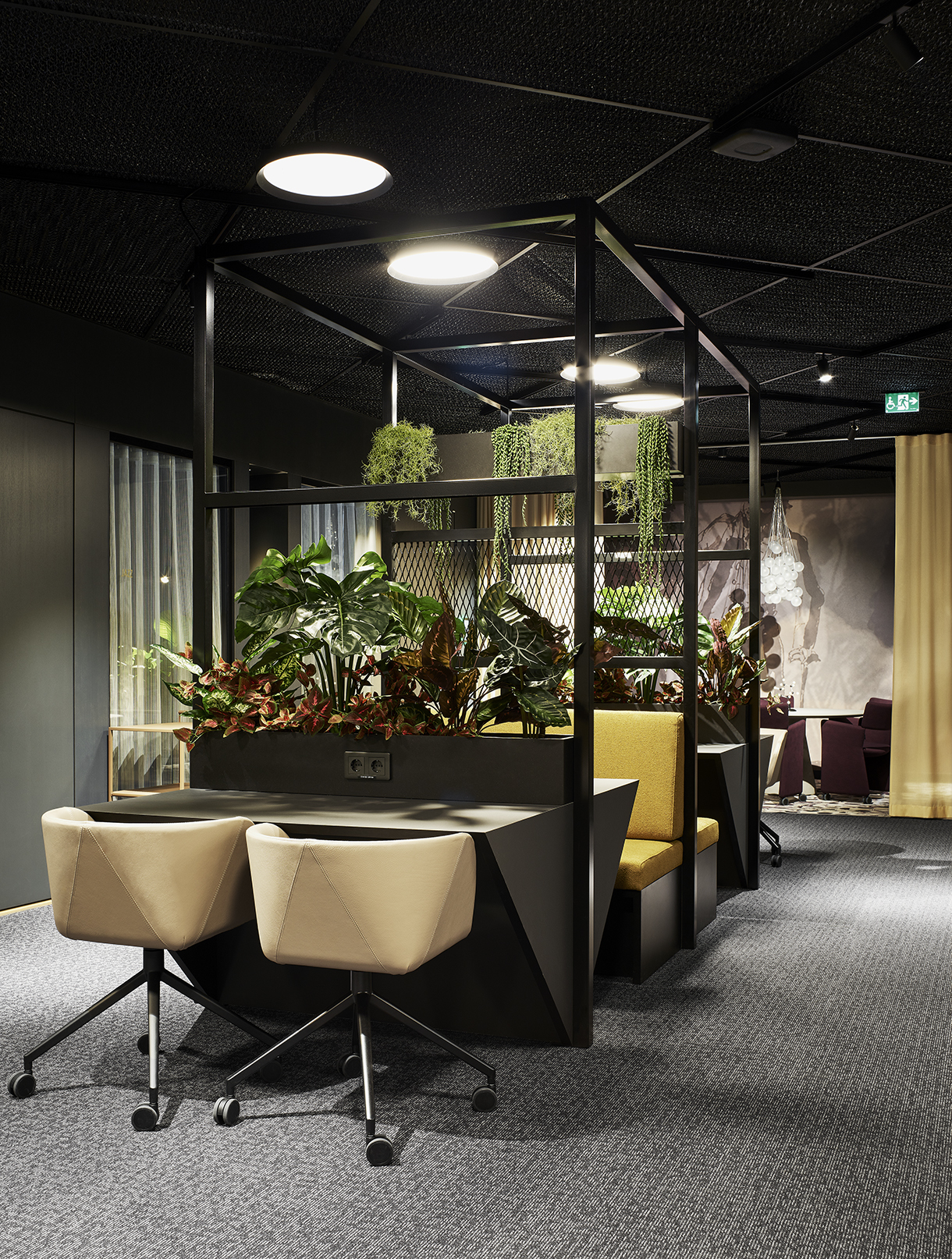 a room with a table and chairs and plants