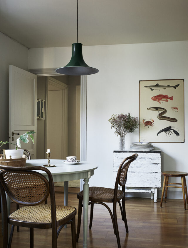 a dining room with a table and chairs