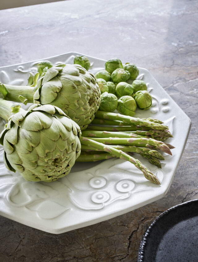 a plate of artichokes and brussels sprouts