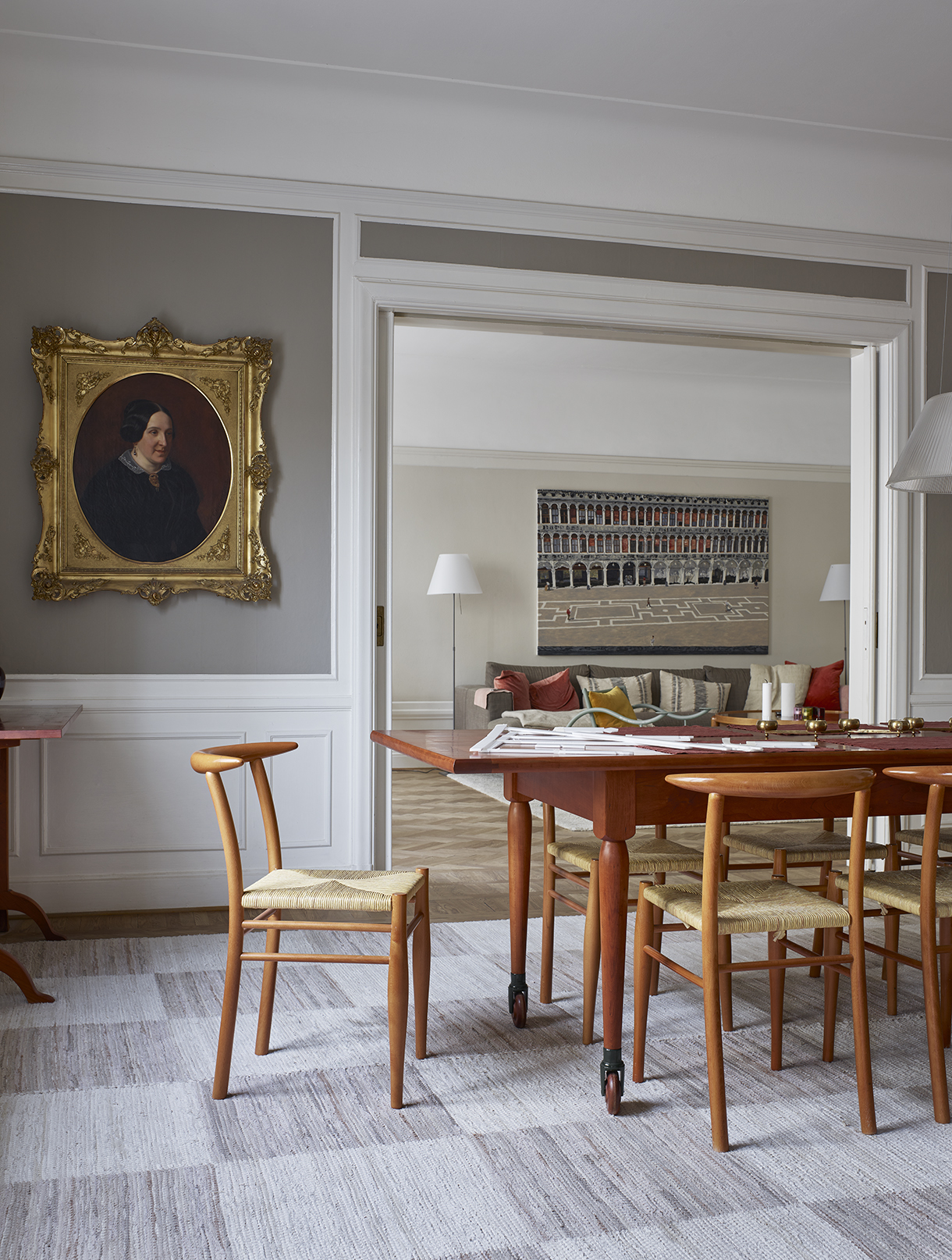 a dining room with a table and chairs
