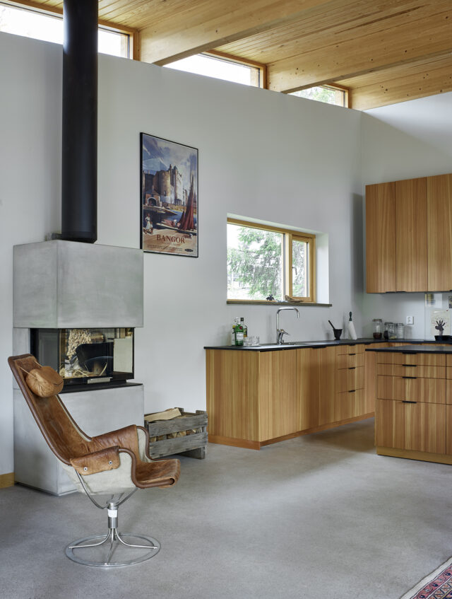 a room with a fireplace and a chair