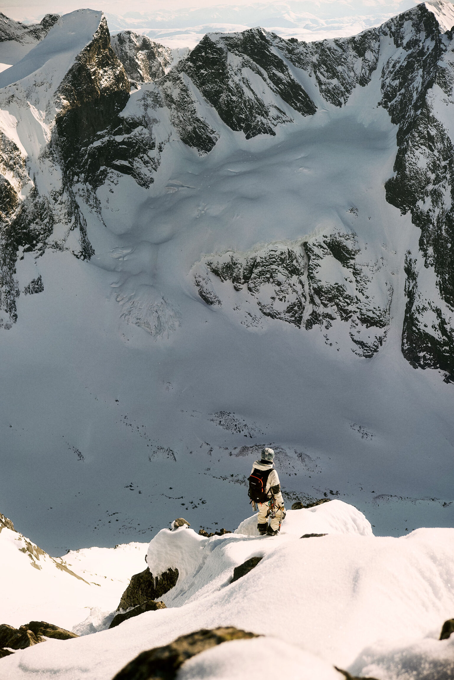 a person standing on a snowy mountain