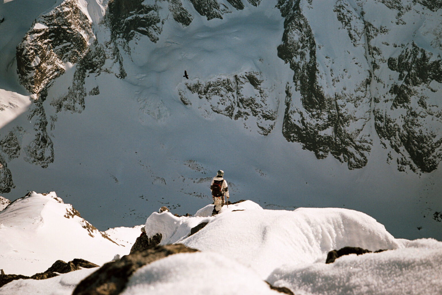 a person standing on a snowy mountain