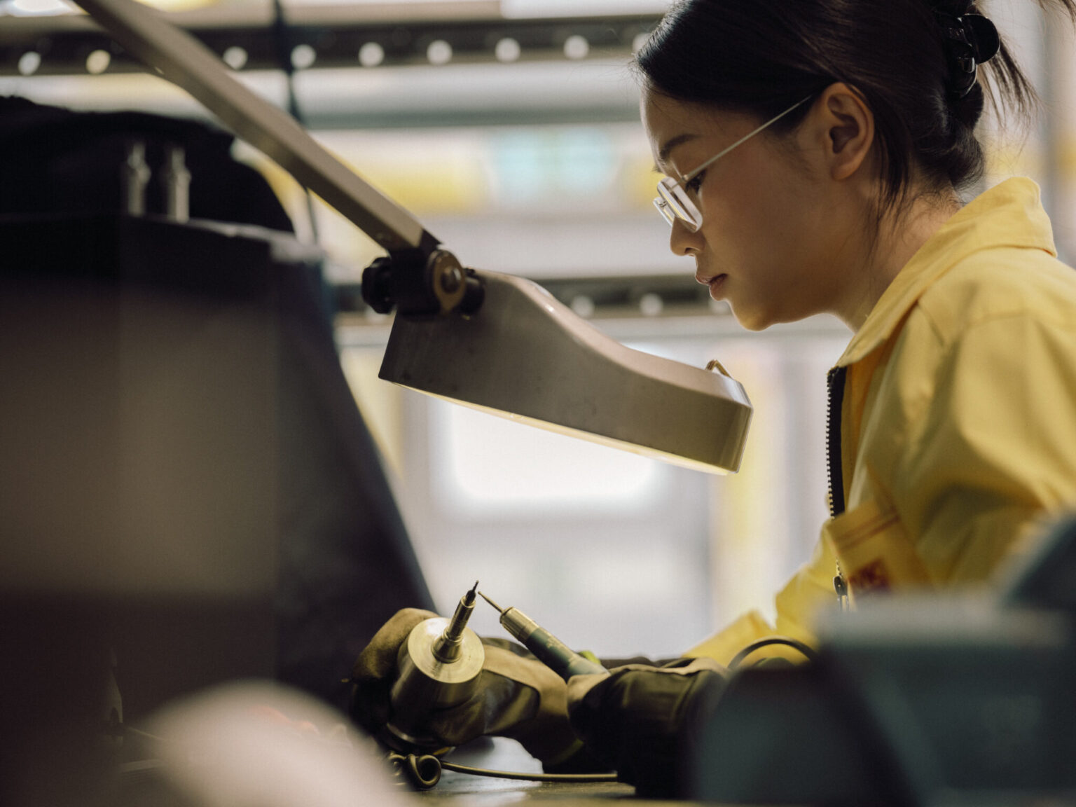 a woman working on a machine
