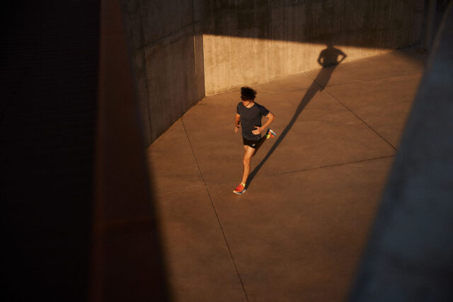 a person running in a concrete area