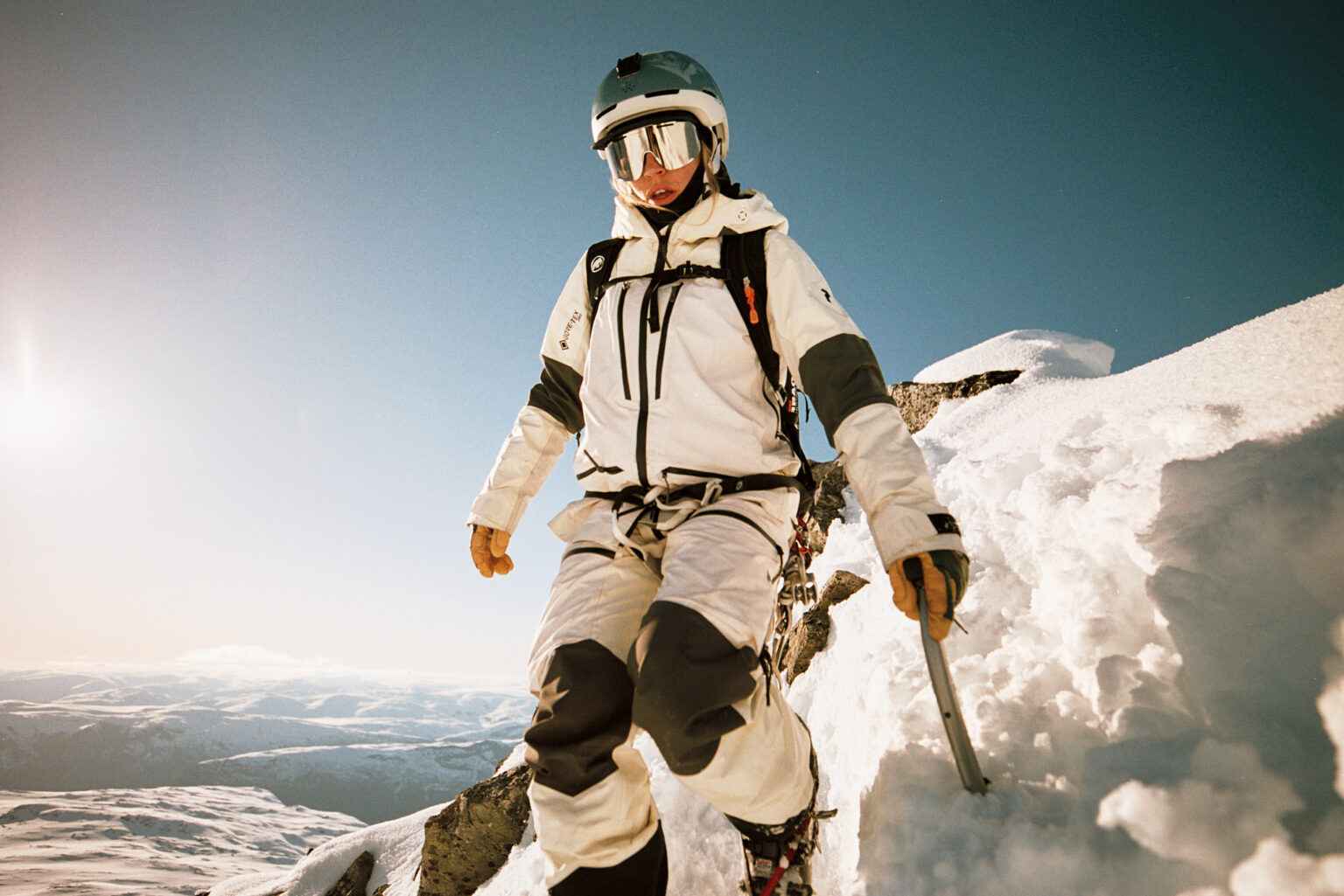 a person in a snow suit and helmet