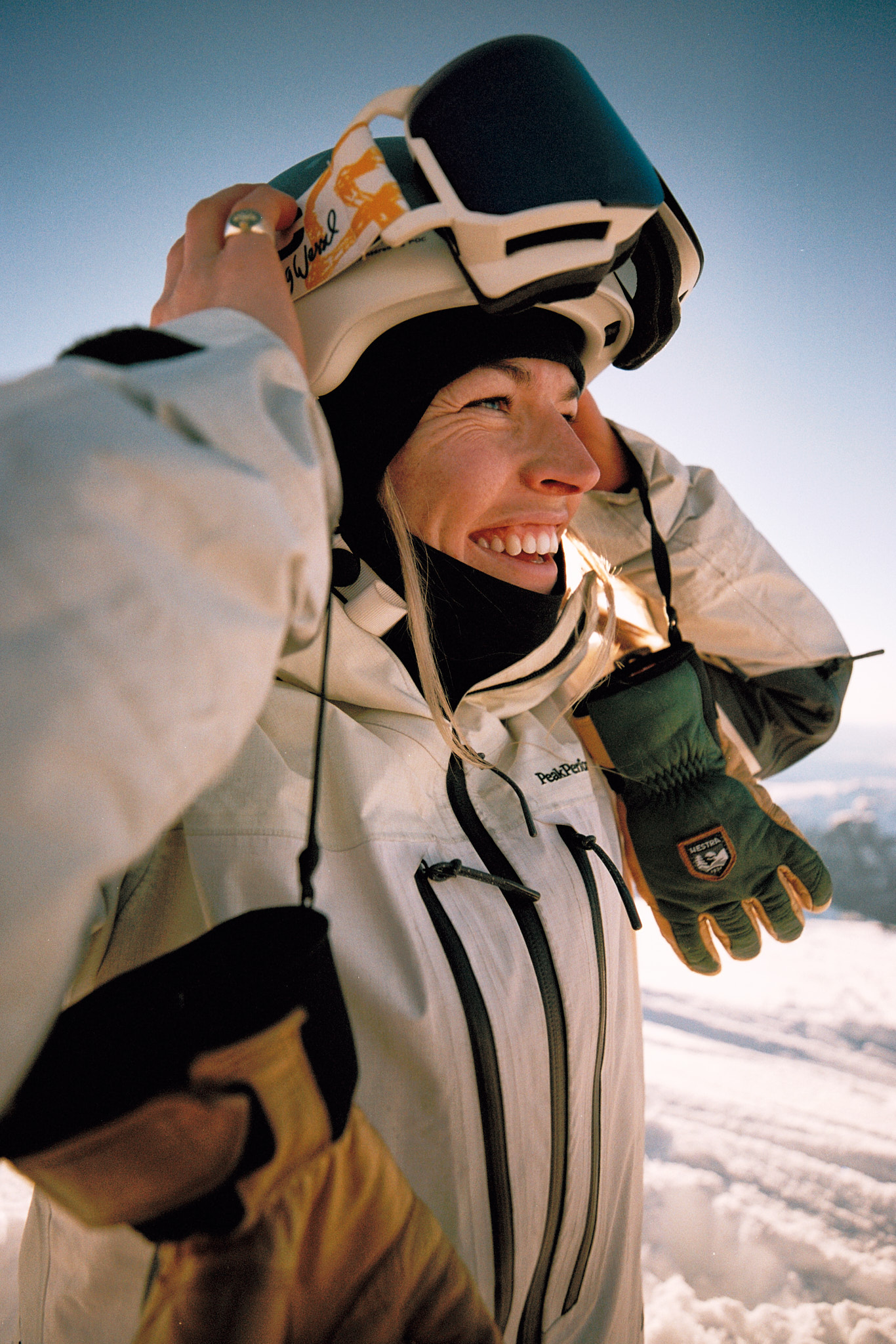 a woman wearing a helmet and gloves