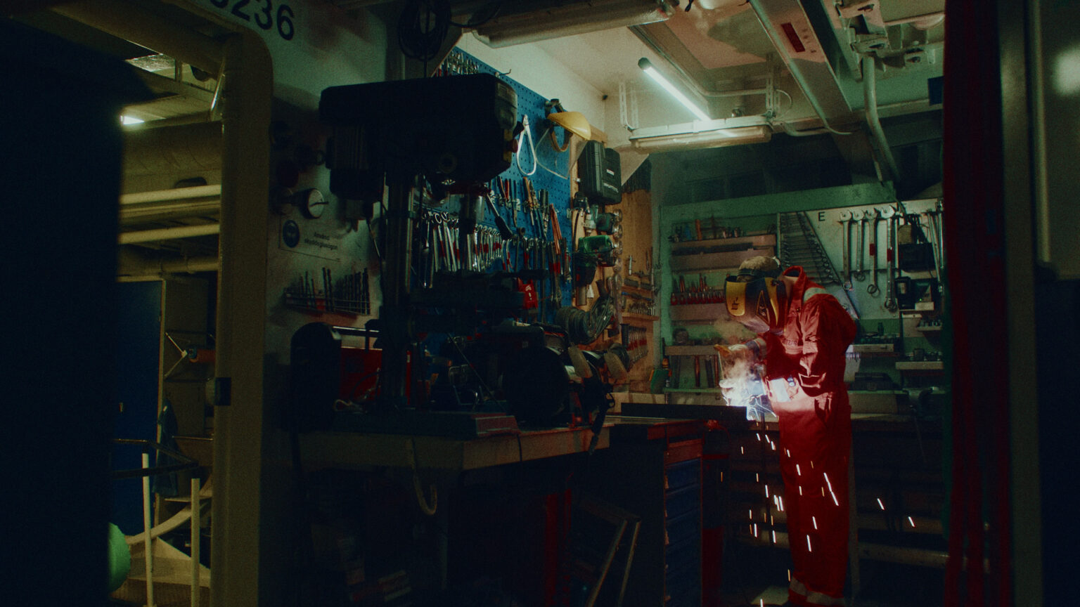 a man wearing a welding suit