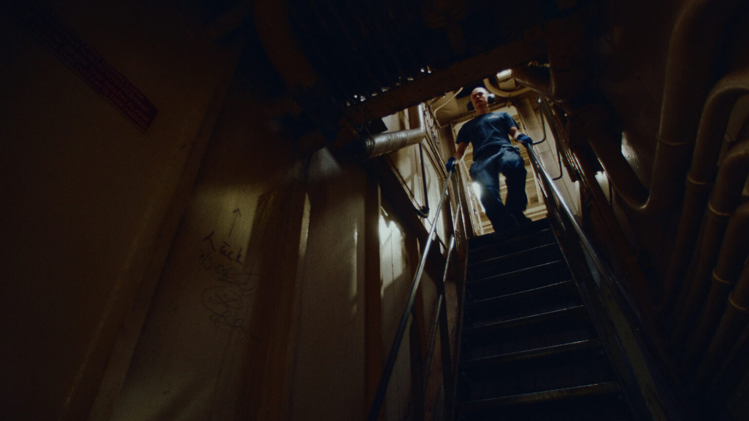 a man climbing up a ladder