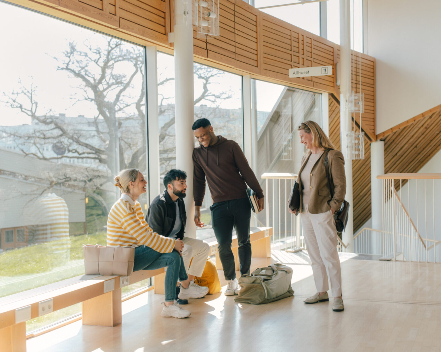 a group of people standing in a hallway