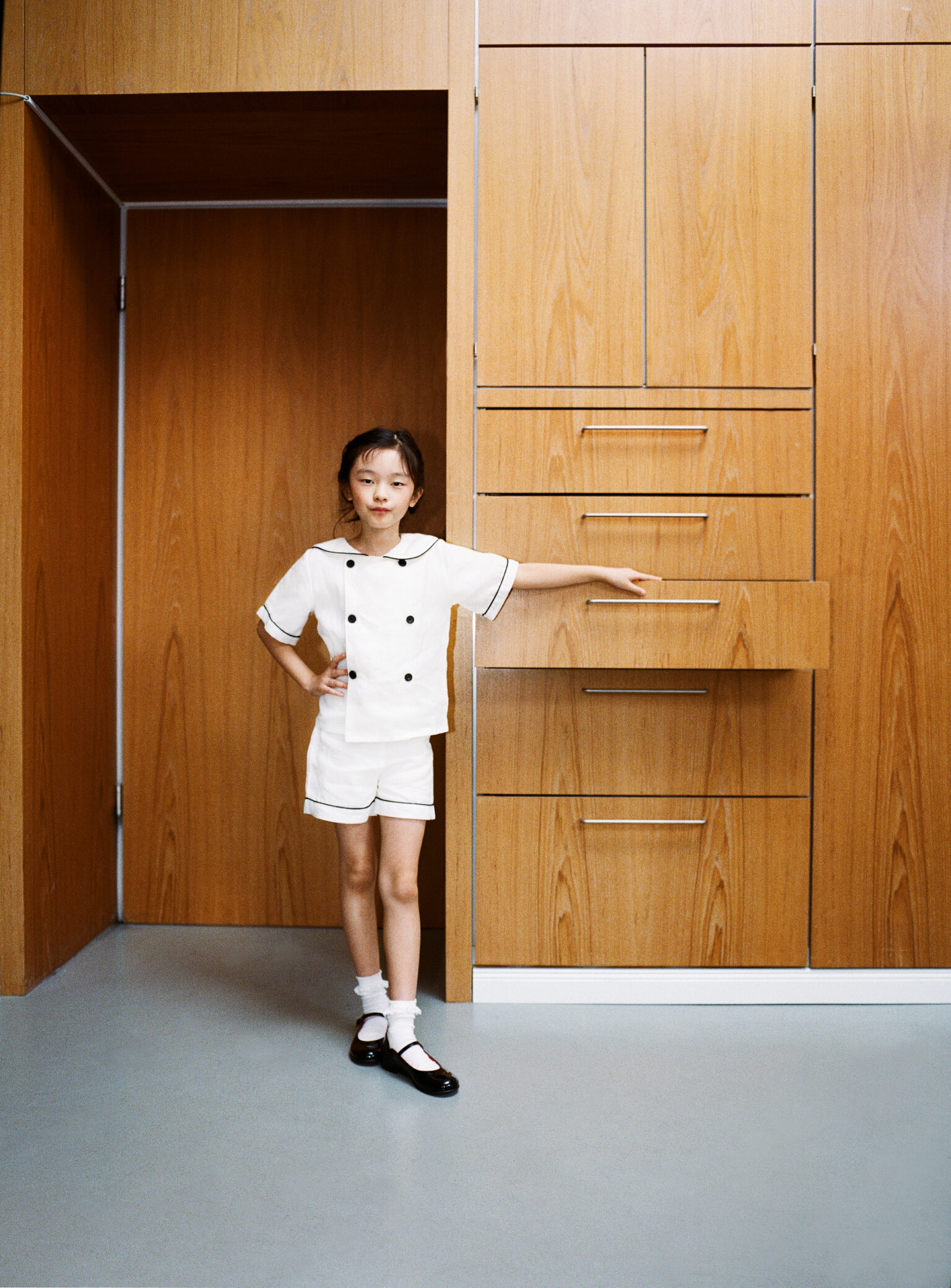 a girl in a white uniform
