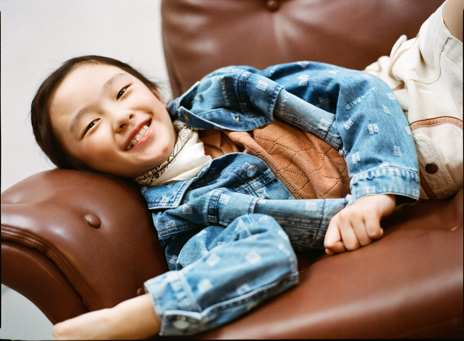 a girl lying on a couch