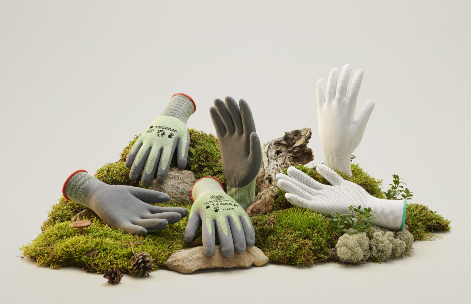a group of gloves on moss
