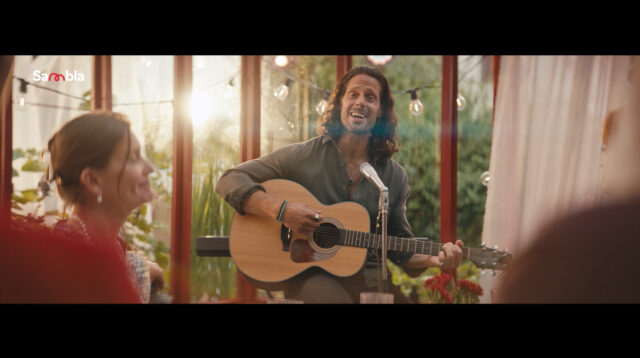 a man playing a guitar