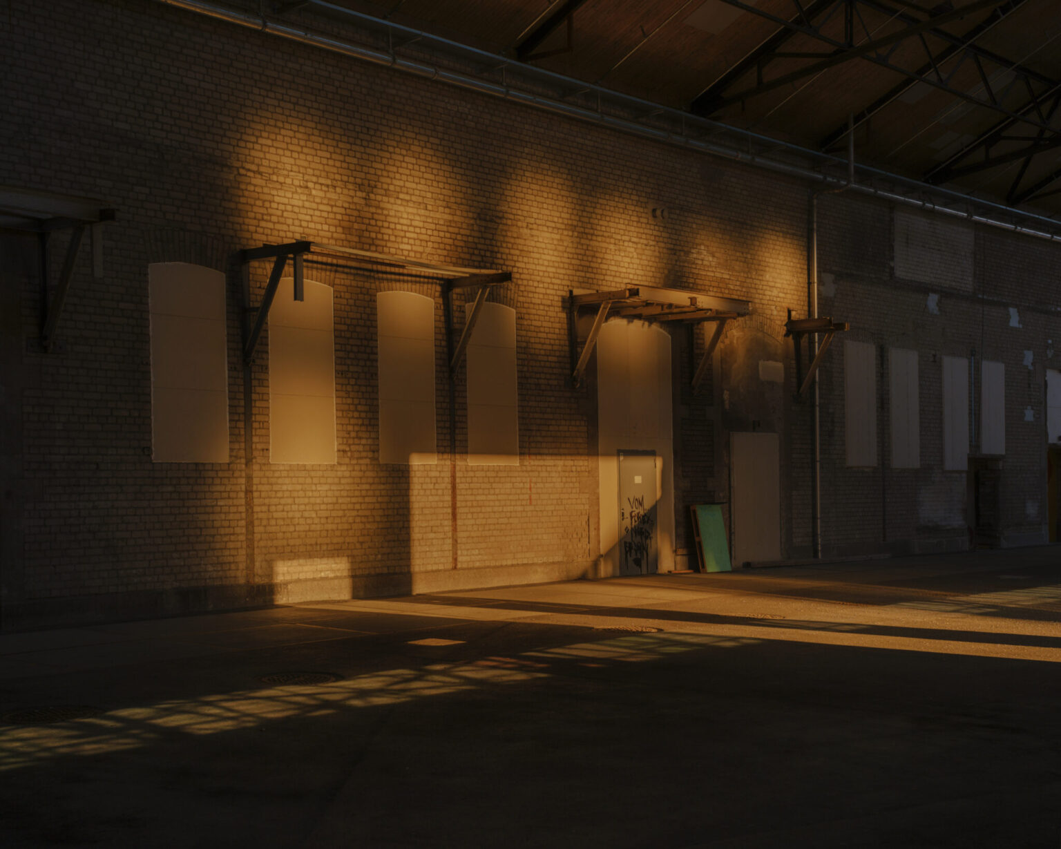 a brick building with a door and windows