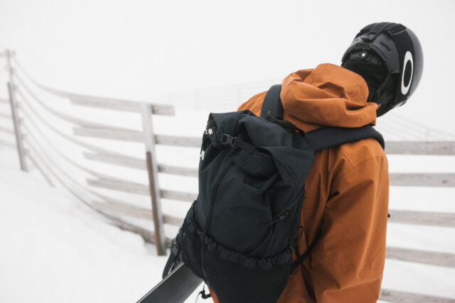 a person wearing a backpack and helmet