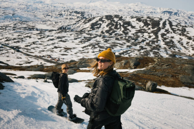 a woman standing on a snowy mountain