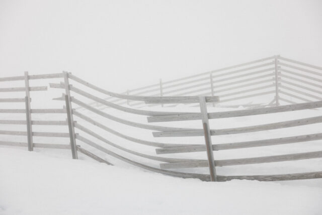 a fence in the snow