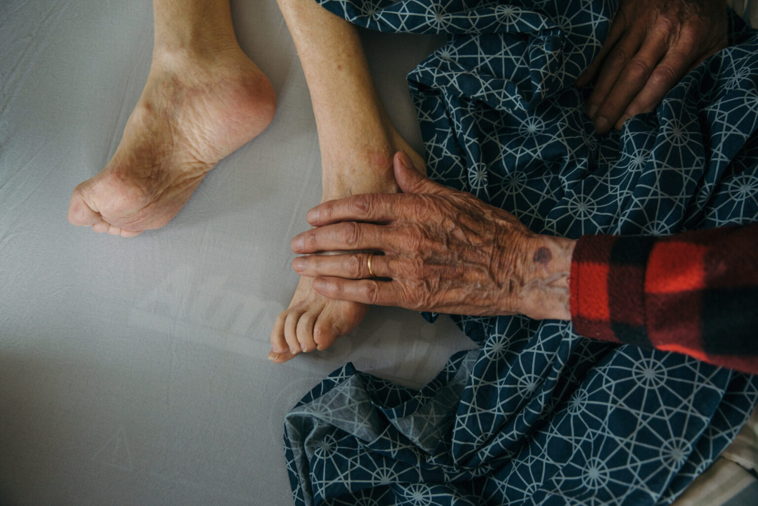a person's hand on a person's foot