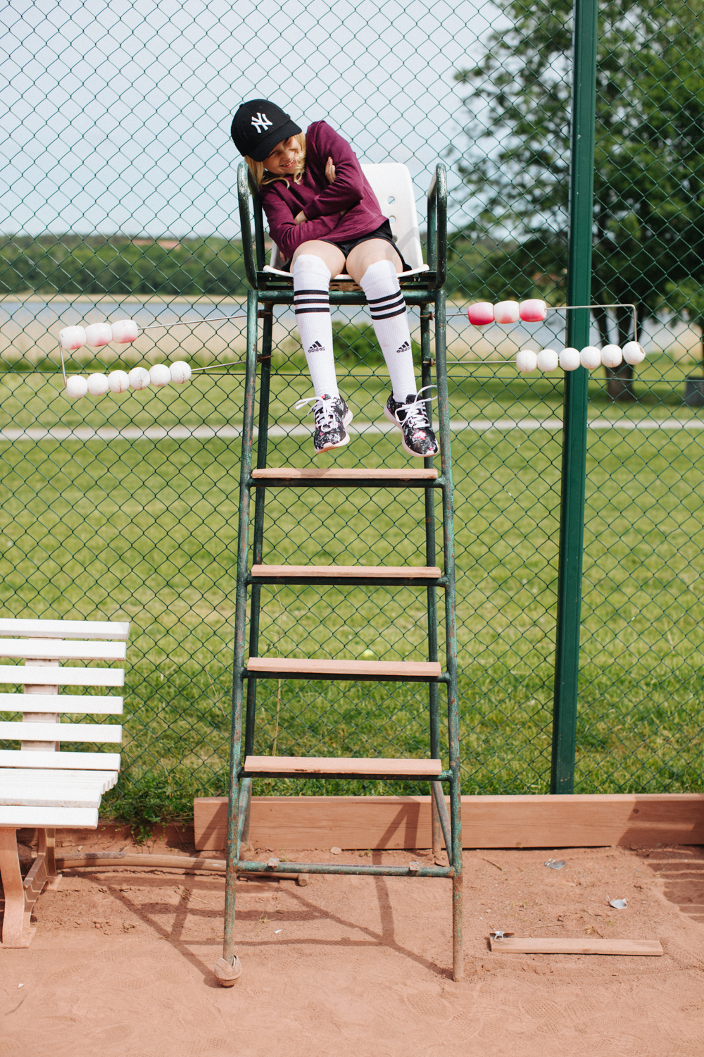 a girl sitting on a chair