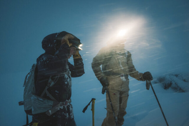 a group of people with ski poles and backpacks