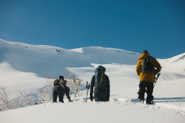 a group of people on a snowy mountain