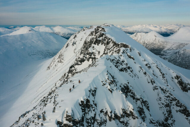 a group of people climbing a mountain