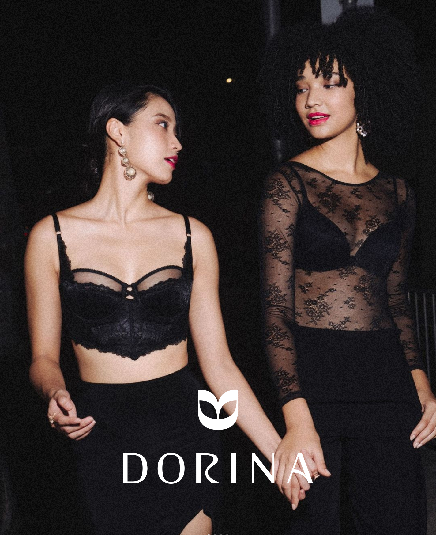 two women in black lace tops