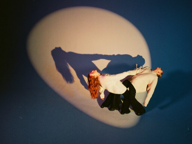 a woman holding a man's leg