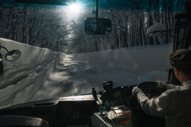 a person driving a vehicle in the snow