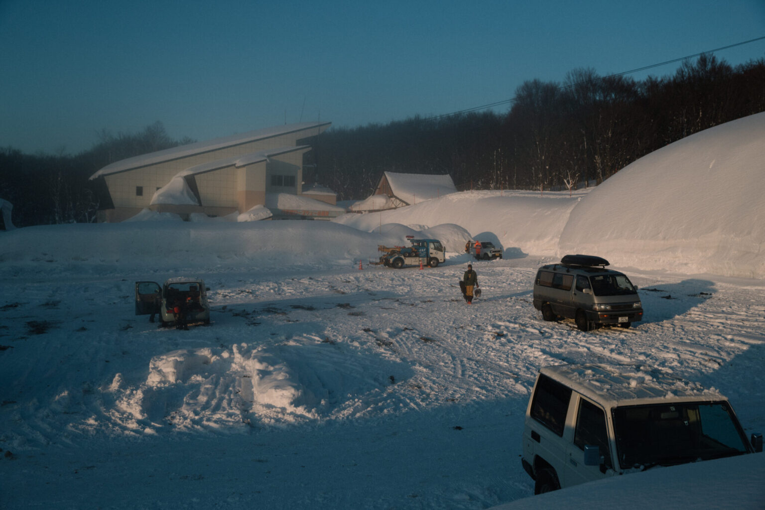 cars parked cars in the snow