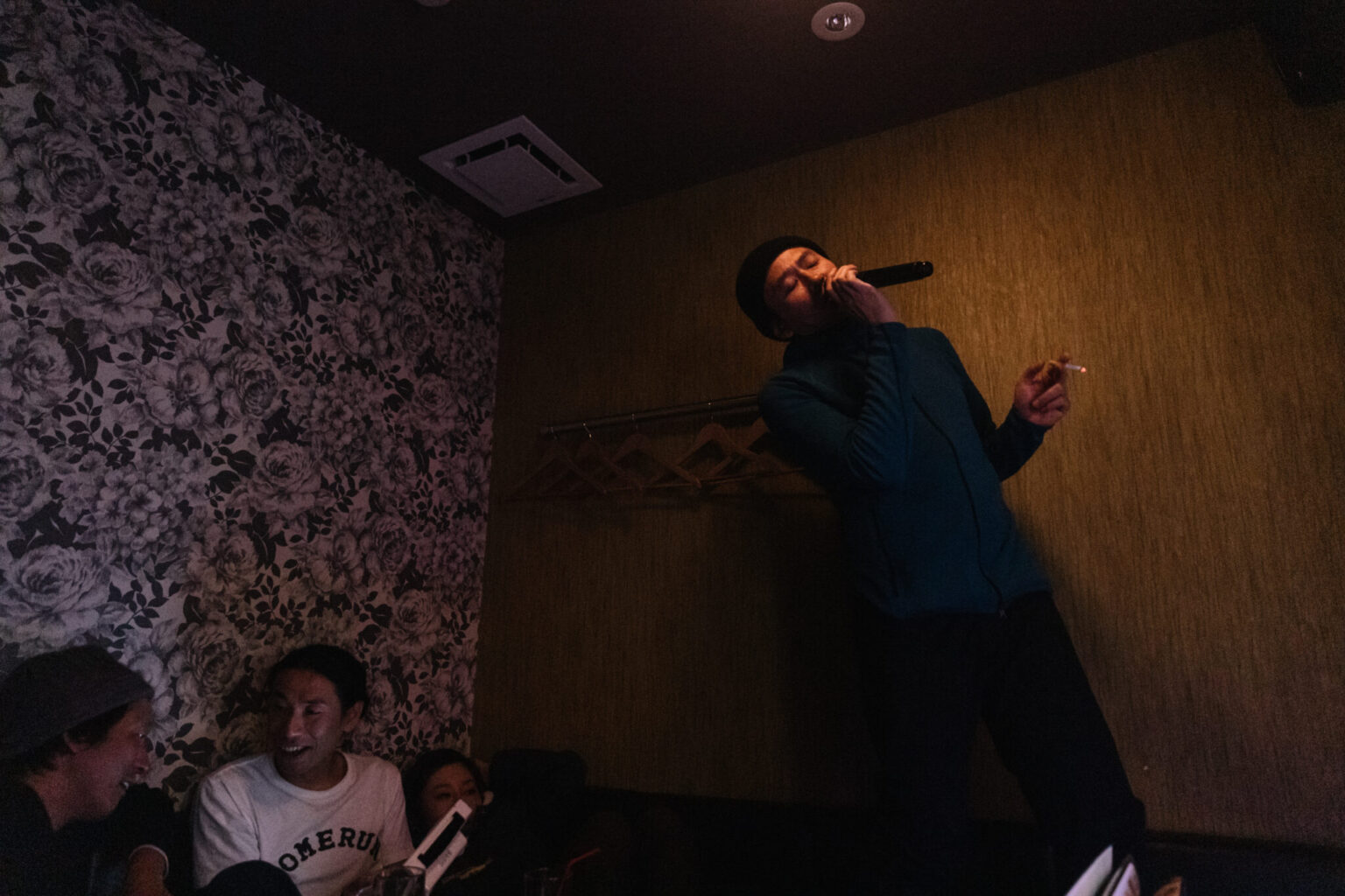 a man singing into a microphone