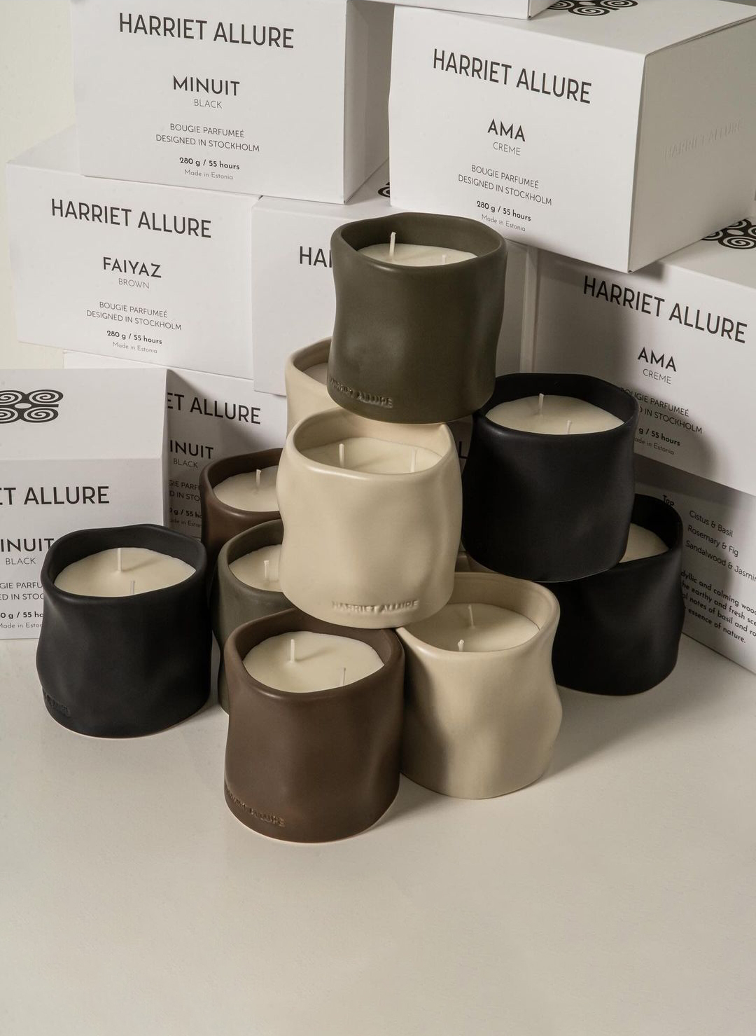 a stack of candles in different colors