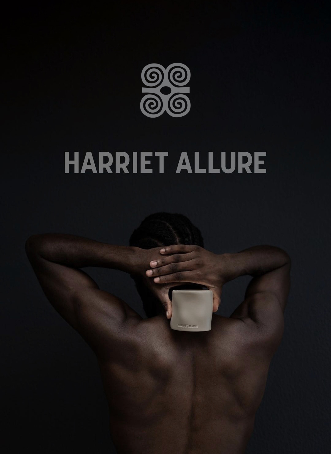a man with his hands behind his head