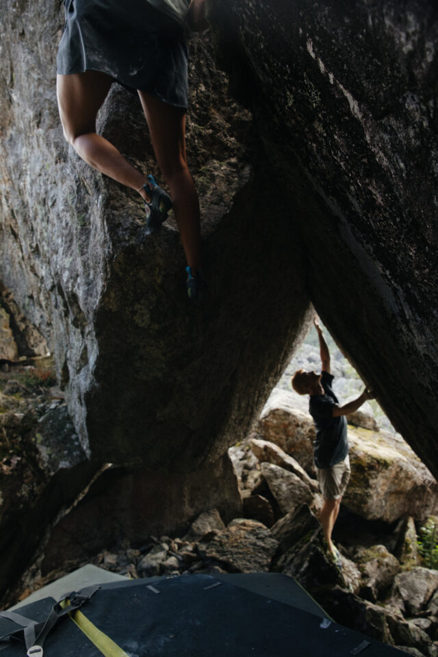 a man climbing a rock