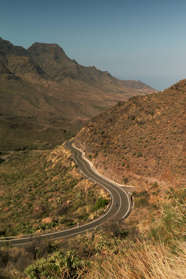 a winding road through a valley