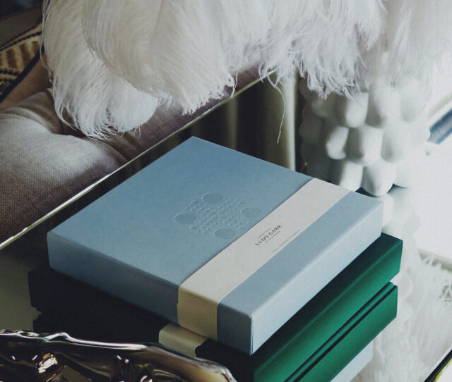 a blue box on top of green and white boxes
