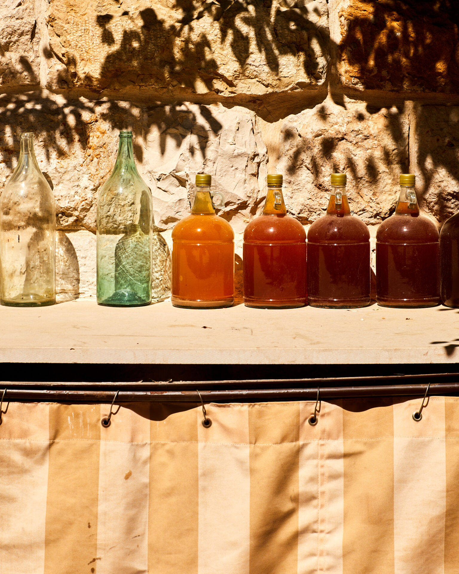 a row of bottles on a counter
