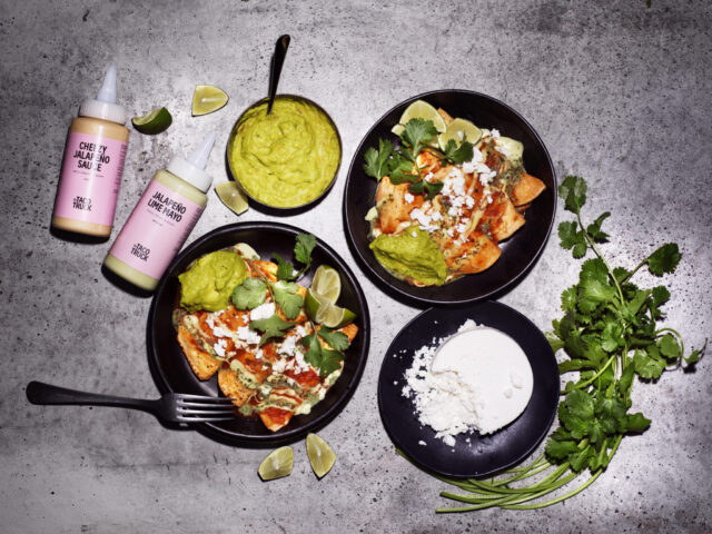 a plate of food with sauces and sauce bottles